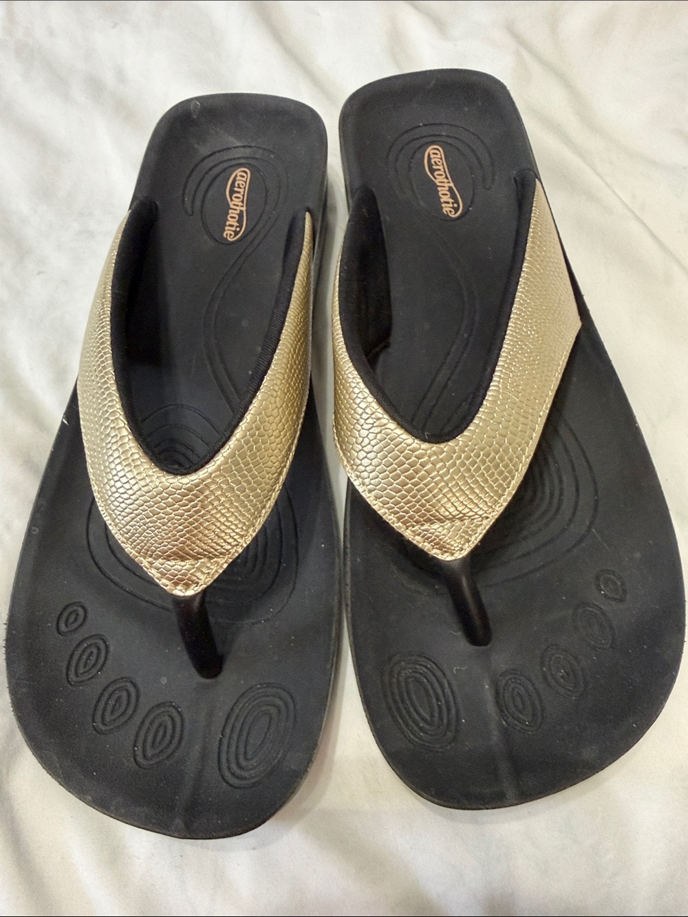 Aerothotie Black Footbed Thong Sandals with Gold Straps